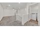 Upstairs loft featuring carpet flooring, a ceiling fan and a laundry closet at 8011 Cavazzo Ave, Las Vegas, NV 89178