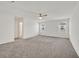 Spacious main bedroom featuring carpet flooring and an ensuite bathroom at 8011 Cavazzo Ave, Las Vegas, NV 89178