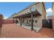 Spacious backyard with a covered patio and privacy fence, perfect for outdoor living at 8176 Duncan Peak Ct, Las Vegas, NV 89139