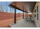 Cozy backyard patio with a dining set, grill, and views of the landscaped yard at 8176 Duncan Peak Ct, Las Vegas, NV 89139