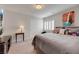 Cozy bedroom featuring a queen size bed, closet, side table, shuttered window, carpet, and wall decor at 8176 Duncan Peak Ct, Las Vegas, NV 89139