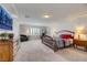 Large bedroom featuring hardwood furniture, TV, and gym equipment at 8176 Duncan Peak Ct, Las Vegas, NV 89139