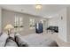 Bedroom featuring shutters, a chest of drawers and a loveseat at 8176 Duncan Peak Ct, Las Vegas, NV 89139