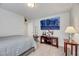 Bedroom with neutral color, large TV and furniture at 8176 Duncan Peak Ct, Las Vegas, NV 89139