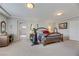 Bedroom featuring a hardwood bed frame and gym equipment at 8176 Duncan Peak Ct, Las Vegas, NV 89139