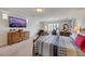 Large bedroom featuring hardwood furniture, TV, and gym equipment at 8176 Duncan Peak Ct, Las Vegas, NV 89139