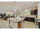 Open concept kitchen featuring an island with bar seating that opens to the living area at 8176 Duncan Peak Ct, Las Vegas, NV 89139