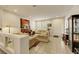 Bright living room featuring neutral walls, shutters, tiled flooring, and traditional furniture at 8176 Duncan Peak Ct, Las Vegas, NV 89139
