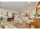 Bright living room with tile flooring, neutral paint, traditional furniture, and open access at 8176 Duncan Peak Ct, Las Vegas, NV 89139
