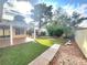 Grassy backyard featuring a covered patio and play set at 8220 Desert Beach Dr, Las Vegas, NV 89128