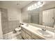 Bathroom featuring double sinks, and a large mirror at 8220 Desert Beach Dr, Las Vegas, NV 89128