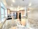 Well-lit kitchen featuring granite countertops, stainless steel appliances, and wood cabinetry at 8220 Desert Beach Dr, Las Vegas, NV 89128