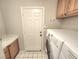 Laundry room featuring cabinets and appliances at 8220 Desert Beach Dr, Las Vegas, NV 89128