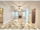 Cozy living room area with tile flooring, a fireplace, and neutral colored walls at 8220 Desert Beach Dr, Las Vegas, NV 89128