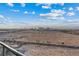 Balcony view overlooks the city with its vibrant skyline and open desert landscape under a clear sky at 8255 Las Vegas Blvd # 1905, Las Vegas, NV 89123