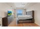 Bright bedroom with hardwood floors, large windows, and a comfortable bed at 8255 Las Vegas Blvd # 1905, Las Vegas, NV 89123