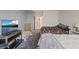 Cozy bedroom featuring a comfortable bed and a media center with a TV at 8255 Las Vegas Blvd # 1905, Las Vegas, NV 89123