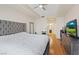 Bright bedroom with a plush bed, hardwood floors, and a modern ceiling fan at 8255 Las Vegas Blvd # 1905, Las Vegas, NV 89123