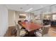 A modern conference room with a large table, comfortable chairs, and glass walls for an open feel at 8255 Las Vegas Blvd # 1905, Las Vegas, NV 89123