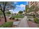 Walkway through beautiful green space with manicured bushes and trees at 8255 Las Vegas Blvd # 1905, Las Vegas, NV 89123