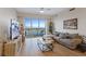 Bright living room with hardwood floors, large windows, and comfortable seating at 8255 Las Vegas Blvd # 1905, Las Vegas, NV 89123