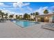 An inviting outdoor pool is lined with palm trees and sun loungers, providing a perfect space for relaxation at 8255 Las Vegas Blvd # 1905, Las Vegas, NV 89123