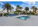 Enjoy this in ground pool surrounded by palm trees and blue accented lounge furniture on a sunny day at 8255 Las Vegas Blvd # 1905, Las Vegas, NV 89123