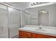 Bathroom features a shower and tub combination and a vanity with a large mirror at 901 Nevada Sky St, Las Vegas, NV 89128