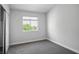 This carpeted bedroom includes a slider closet door and a window that lets in lots of natural light at 901 Nevada Sky St, Las Vegas, NV 89128