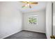 Carpeted bedroom features a bright window view and a ceiling fan to keep you cool at 901 Nevada Sky St, Las Vegas, NV 89128