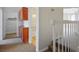 Hallway view featuring built-in wooden cabinets, staircase, and doorways to bedrooms and bathrooms at 901 Nevada Sky St, Las Vegas, NV 89128