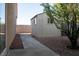 Backyard featuring a storage shed, desert landscaping, a walkway, and providing extra storage and outdoor charm at 904 Swift Bear St, Henderson, NV 89002
