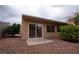 Quaint backyard featuring desert landscaping, a small patio, and ample sunlight with convenient access from the home at 904 Swift Bear St, Henderson, NV 89002