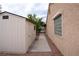 Backyard with a storage shed, desert landscaping, and pathway providing utility and enhancing outdoor space at 904 Swift Bear St, Henderson, NV 89002