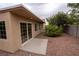 Backyard space with desert landscaping, patio, and garden area with a tree, enhancing the property's outdoor appeal at 904 Swift Bear St, Henderson, NV 89002
