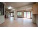 Finished basement with tile flooring, ceiling fans and sliding doors to the backyard at 904 Swift Bear St, Henderson, NV 89002