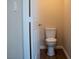 Bathroom with a toilet and a white door with brushed nickel hardware at 904 Swift Bear St, Henderson, NV 89002