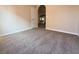 Bedroom with neutral color walls and carpet and a door leading to another room in the house at 904 Swift Bear St, Henderson, NV 89002