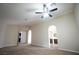 Spacious bedroom with ceiling fan and arched doorways to other rooms in the house at 904 Swift Bear St, Henderson, NV 89002