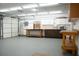 Spacious garage featuring built-in cabinets, work benches, and epoxy flooring at 904 Swift Bear St, Henderson, NV 89002