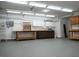 Spacious garage featuring built-in cabinets, work benches, and epoxy flooring at 904 Swift Bear St, Henderson, NV 89002