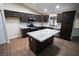 Well-appointed kitchen featuring granite countertops, and stainless steel appliances and dark wood cabinets at 904 Swift Bear St, Henderson, NV 89002