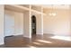 Bright open living room featuring vinyl floors, neutral paint, and an arched doorway at 904 Swift Bear St, Henderson, NV 89002