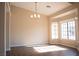 Bright open living room featuring vinyl floors, neutral paint, and lots of natural light at 904 Swift Bear St, Henderson, NV 89002