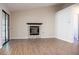 Open living room featuring a modern fireplace and sliding glass door for easy outdoor access at 904 Swift Bear St, Henderson, NV 89002
