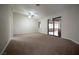 Spacious primary bedroom featuring neutral carpet and access to ensuite bath and outdoor patio at 904 Swift Bear St, Henderson, NV 89002