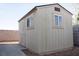 Exterior view of a well-maintained shed with matching windows and door at 904 Swift Bear St, Henderson, NV 89002