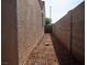 View of the side yard featuring a textured wall and gravel landscaping at 904 Swift Bear St, Henderson, NV 89002