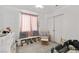 Cozy bedroom with plush seating area, soft rug, and charming decor at 9105 Chenin Ave, Las Vegas, NV 89129