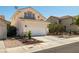 Charming two-story home with a well-maintained front yard, two car garage and mature landscaping at 9105 Chenin Ave, Las Vegas, NV 89129
